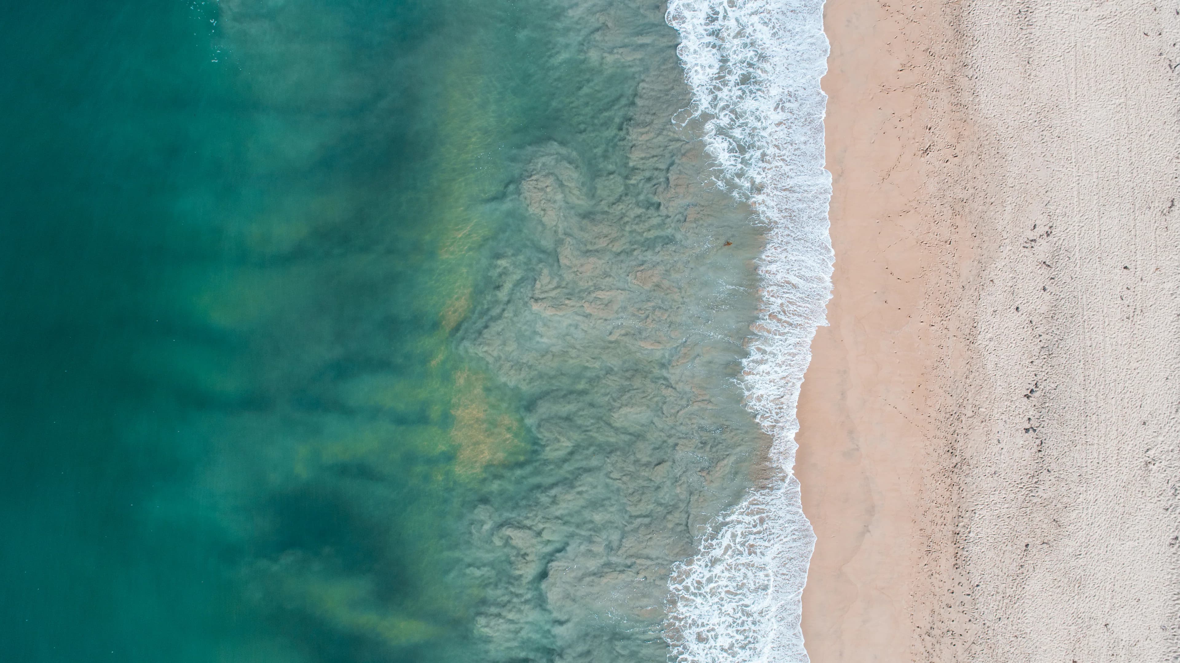 Aerial shoreline representing Marram Cabinetry's commitment to lasting communities